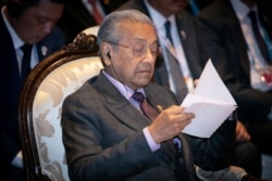 FILE - Malaysia's Prime Minister Mahathir Mohamad participates in an ASEAN-U.N. summit in Nonthaburi, Thailand, Nov. 3, 2019.