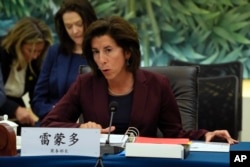 US Commerce Secretary Gina Raimondo, right, speaks during a meeting with her Chinese counterpart Wang Wentao, unseen, at the Ministry of Commerce in Beijing, Aug. 28, 2023.