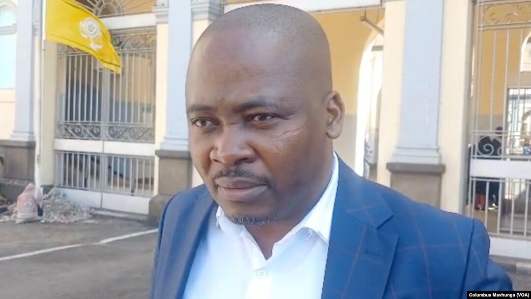 Charles Kwaramba, of the group Zimbabwe Lawyers for Human Rights, speaks to reporters outside Harare Magistrates Court, Sept. 4, 2024.