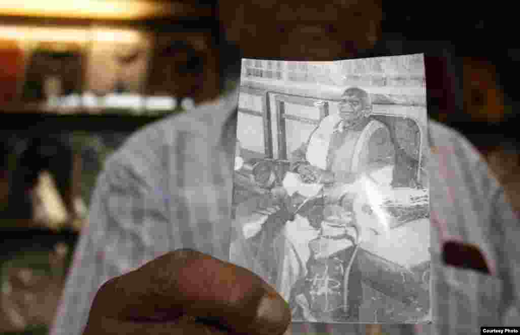 Chhiba holds a photograph of his deceased father, Ramjee, the founder of the family business. Photo by Darren Taylor