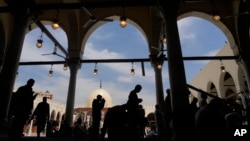 FILE - Muslims attend Friday prayers during the Muslims holy fasting month of Ramadan, at Amr ibn al-Aas Mosque, in Cairo, Egypt, April 14, 2023.