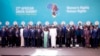 Passports, Proposals, Postponements Highlight AU Summit