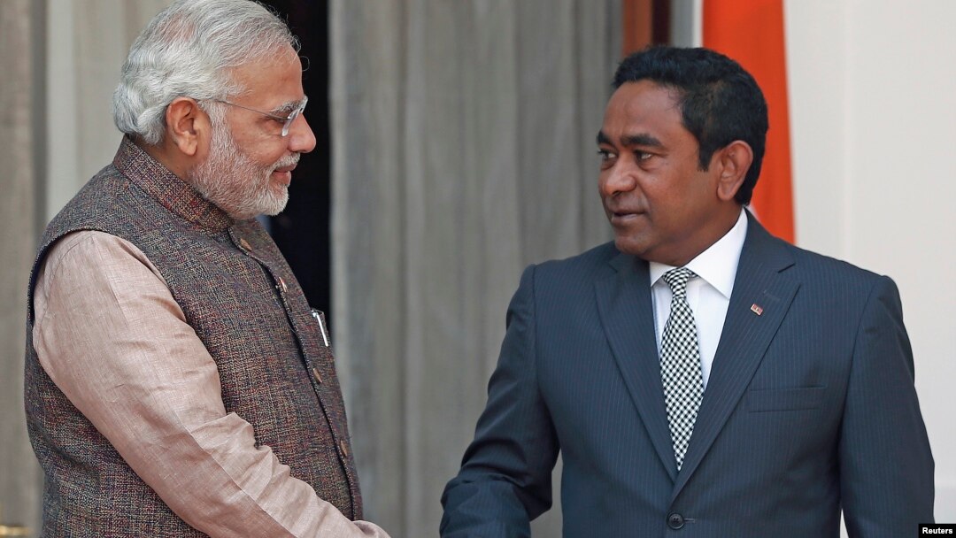 File - India's Prime Minister Narendra Modi (L) shakes hands with Maldives President Abdulla Yameen before the start of their bilateral meeting in New Delhi.