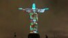 Drapeaux des pays touchés par le nouveau coronavirus projetés sur la statue du Christ Rédempteur à Rio de Janeiro, Brésil, 18 mars 2020. (Photo: Forian Plancheur/AFP)