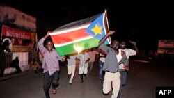 FILE PHOTO - In this photo taken on July 9, 2011, residents of Juba in South Sudan celebrate in the streets the birth of their new nation. South Sudan marked a decade of independence on July 9.