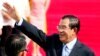 Cambodian Prime Minister Hun Sen waves to the crowd as he arrives at Clark International Airport, north of Manila, Philippines Saturday, Nov. 11, 2017. Hun Sen is one of more than a dozen leaders who will be attending the 31st ASEAN Summit and Related Sum