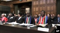 FILE — South African representatives attend the opening hearings of their case against Israel's military offensive in Gaza at the International Court of Justice in The Hague, Netherlands, Thursday, Jan. 11, 2024. 