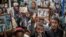 Members of Ethiopia's Jewish community hold pictures of their relatives in Israel, during a solidarity event at the synagogue in Addis Ababa, Ethiopia, Feb. 28, 2018. 
