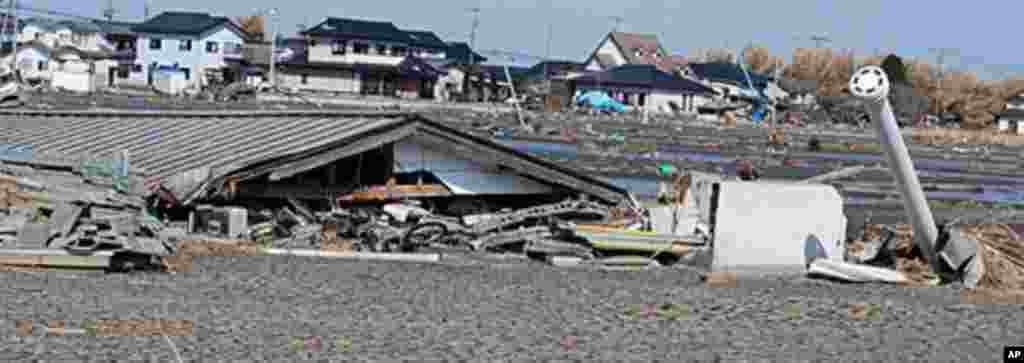 A building in the hot zone flattened by the March 11 tsunami, Namie, Fukushima Pref., Japan, March 12 2011 (VOA - S. L. Herman)