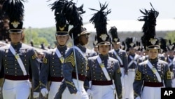 FILE - Cadet Isabella Minter, center, marches with senior class members during Parade Day at the U.S. Military Academy in West Point, N.Y., May 22, 2019.