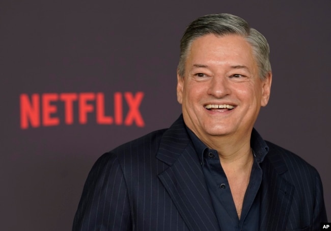 FILE - Netflix co-CEO Ted Sarandos poses at the premiere of the Netflix film "Good Grief," on Dec. 19, 2023, in Los Angeles. The typical compensation package for chief ｅxecutives who run companies in the S&P 500 jumped nearly 13% in 2023. (AP Photo/Chris Pizzello, File)