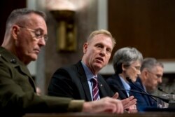 FILE - Acting Defense Secretary Patrick Shanahan, center, speaks during a Senate Armed Services Committee hearing on Capitol Hill in Washington, April 11, 2019.