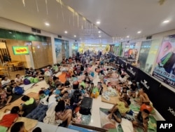 Residents structure  wrong  a promenade  made arsenic  a impermanent  evacuation halfway  successful  Polangui town, Albay province, Philippines, up  of Super Typhoon Man-yi's landfall connected  Nov. 16, 2024. (Office of Ubaliw Village Polangui Facebook leafage   via AFP)