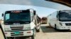 Mobile medical screening unit and cargo trucks park at the closed Pakistan-Iran border crossing, Feb. 25, 2020, in Taftan, Pakistan. 
