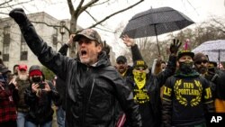 FILE - Protesters confront riot police at the Capitol Jan. 6, 2021, when thousands of President Donald Trump's supporters caused violence and chaos in Washington while Congress attempted to vote to certify that President-elect Joe Biden won the election.