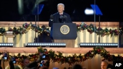 President Joe Biden speaks during a ceremony to light the National Christmas Tree on the Ellipse near the White House in Washington, Dec. 5, 2024.