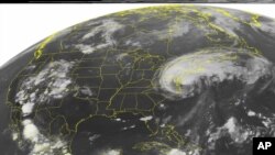 FILE - A 2019 NOAA satellite image shows Hurricane Irene, a category 2 storm with winds up to 100 mph and located about 400 miles southeast of Nassau. A study published Oct. 14, 2019, says scientists have discovered 'stormquakes.' 