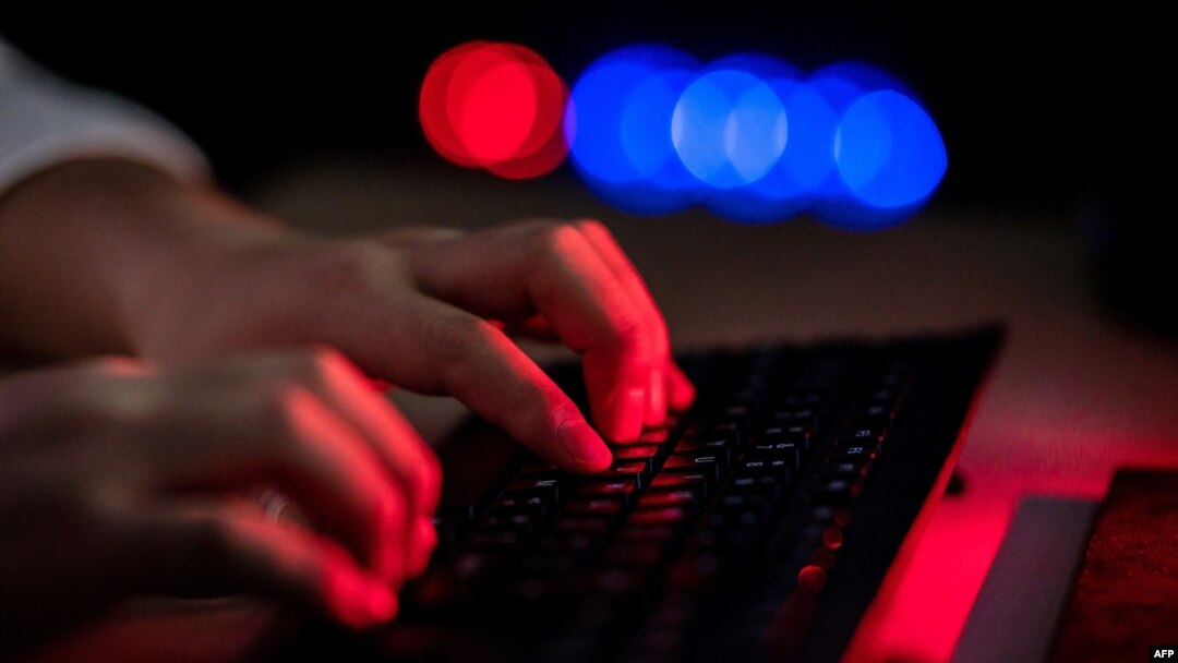 An instructor teaches an online coding class at Tarena International's Zhongguancun campus in Beijing on July 24, 2020. 