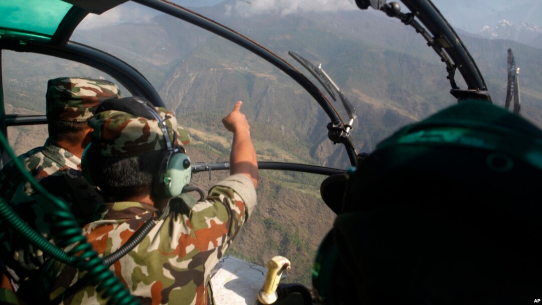 Nepalese army men search for the missing U.S. Marine helicopter in the earthquake affected Dolakha District, Nepal, May 14, 2015.