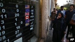 An exchange shop displays rates for various currencies, in downtown Tehran, Iran, Oct. 2, 2018.