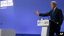 John Kerry, United States Special Presidential Envoy for Climate gestures as he speaks during a press conference at the COP26 U.N. Climate Summit in Glasgow, Scotland, Nov. 5, 2021. 