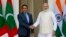 Indian Prime Minister Narendra Modi, right, shakes hands with Maldives' President Yameen Abdul Gayoom before a delegation level meeting in New Delhi, April 11, 2016. 