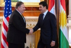 U.S. Secretary of State Mike Pompeo left, meets with Nechirvan Barzani, outgoing Prime Minister of Iraq's autonomous Kurdistan Regional Government (KRG), in the province's capital Irbil, Iraq, Jan. 9, 2019.