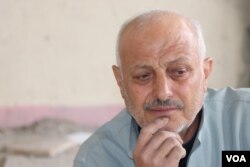 Ahmed Hashem, 60, lost 20 family members in Syria's civil war before witnessing the most gruesome violence he had ever seen in Idlib province, Syria, over the past three months, pictured in Raqqa, Feb. 23, 2020. (Heather Murdock/VOA)