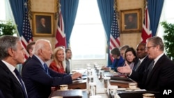 British Prime Minister Keir Starmer, right, and Foreign Secretary David Lammy, second right, meet with U.S. President Joe Biden, center left, at the White House in Washington, Sept. 13, 2024. 