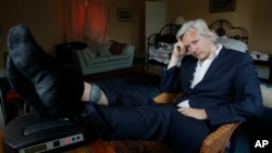 FILE - WikiLeaks founder Julian Assange is seen with his ankle security tag at the house where he is required to stay, near Bungay, England, June 15, 2011.