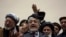 Afghan presidential candidate Abdullah Abdullah, center, addresses the media following a meeting with his party members, in Kabul, Afghanistan, Feb. 18, 2020.