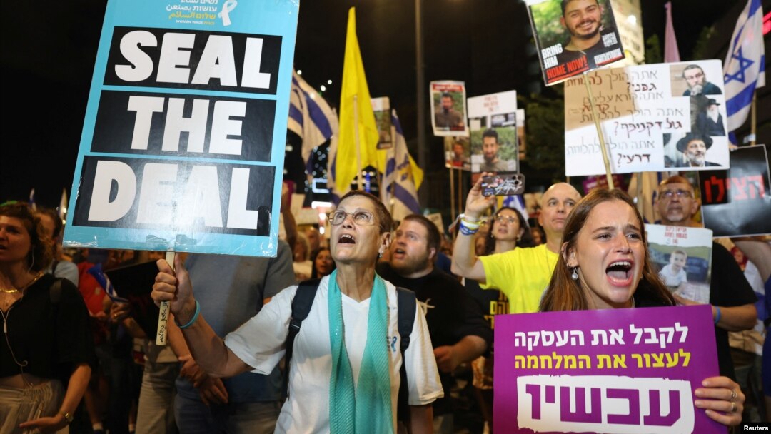 People hold placards showing support for hostages who were kidnapped during the deadly October 7 attack, amid the ongoing conflict in Gaza between Israel and Hamas, in Tel Aviv, Israel, Sept. 3, 2024. 