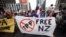 Protesters march to the venue of the Trans-Pacific Partnership signing in Auckland, New Zealand, Feb 4, 2016.