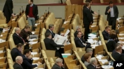 FILE - Russian lawmakers attend a session of the lower house of parliament, the State Duma in Moscow, Russia.