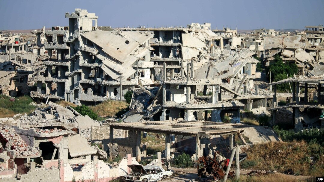 A picture taken on June 1, 2018, shows a view of destroyed buildings in a rebel-held area in the southern Syrian city of Daraa.