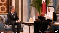 FILE - US Secretary of State Antony Blinken, left, meets with Qatar's Amir Sheikh Tamim bin Hamad Al Thani at Lusail Palace, in Doha, Qatar, February 6, 2024.