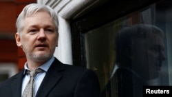 FILE - WikiLeaks founder Julian Assange speaks to the media from the balcony of the Ecuadorian embassy, in central London, Britain, Feb. 5, 2016.