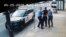 FILE - Minneapolis police Officers Thomas Lane, left, and J. Alexander Kueng, right, escort George Floyd, center, to a police vehicle outside Cup Foods in Minneapolis, on May 25, 2020, in this image from video.