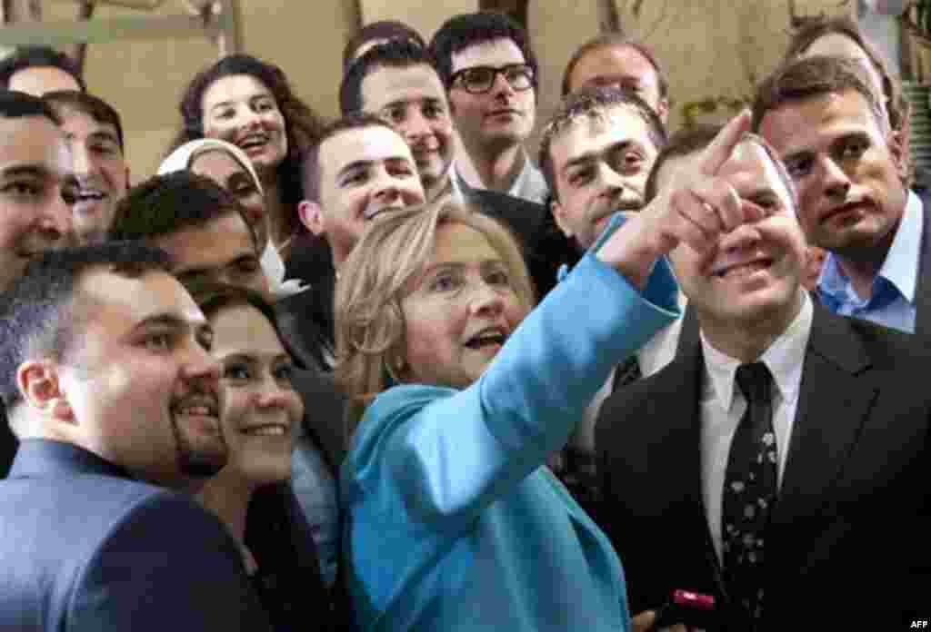 US Secretary of State Hillary Rodham Clinton stands alongside Turkish students and young leaders following the taping of a Turkish television special "Coffee Break with Hillary Clinton" hosted by CNN-Turk, at Ceyazin Cafe in Istanbul, Turkey, on Saturday 