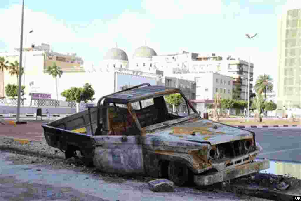 This photograph, obtained by The Associated Press outside Libya and taken by an individual not employed by AP, shows a damaged vehicle during recent days' unrest in Benghazi, Libya. (AP Photo) EDITOR'S NOTE: THE AP HAS NO WAY OF INDEPENDENTLY VERIFYING TH