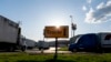 FILE - Semitrucks head to the truck parking lot at the Love's Travel Stop truck stop in Greenville, Va. During the coronavirus outbreak truckers continue to work so the supply chain is not disrupted.