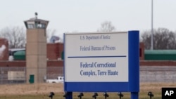FILE - This Dec. 10, 2019, photo shows the entrance to the US Penitentiary in Terre Haute, Ind. 