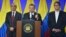 Colombia's President Juan Manuel Santos, center, speaks during a news conference in Bogota, Colombia, March 12, 2018. 