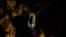 FILE - A man walks in a tunnel at a gold mine in El Callao, Bolivar state, Venezuela, March 1, 2017.