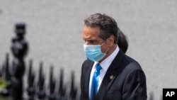 New York Gov. Andrew Cuomo walks toward the West Wing as he arrives at the White House, in Washington, for a meeting with President Donald Trump, May 27, 2020.