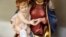 FILE - A statue of Saint Mary and an infant Jesus are displayed for sale in a religious souvenir shop in Rome.