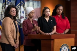 From left, Rep. Rashida Tlaib, D-Mich., Rep. Ilhan Omar, D-Minn., Rep. Alexandria Ocasio-Cortez, D-N.Y., and Rep. Ayanna Pressley, D-Mass., respond to remarks by President Donald Trump.