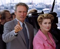 FILE - President of the Jury at the 47th Cannes Film Festival, U.S. director and actor Clint Eastwood, left , and Vice President and French actress Catherine Deneuve are seen during a photo call, May 12, 1994.