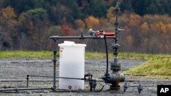 FILE - The well head for a gas well is seen Oct. 14, 2011, in Dimock, Pennsylvania, where regulators blame faulty gas wells for leaking methane into the groundwater.