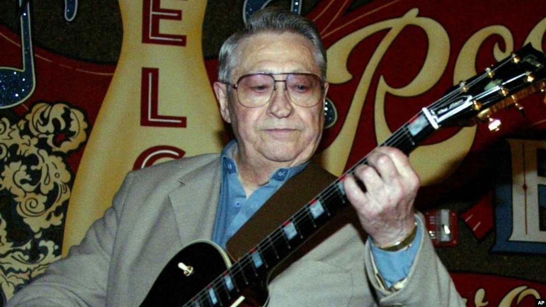 FILE - Scotty Moore, a former guitarist for Elvis Presley, playing music at the 2nd annual Ponderosa Stomp in New Orleans.
